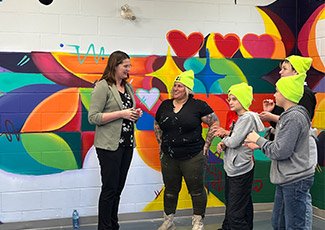 Mural in the youth centre and participants